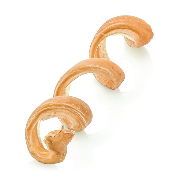 Three pieces of Curly Bully Sticks from Best Bully Sticks on a white surface.