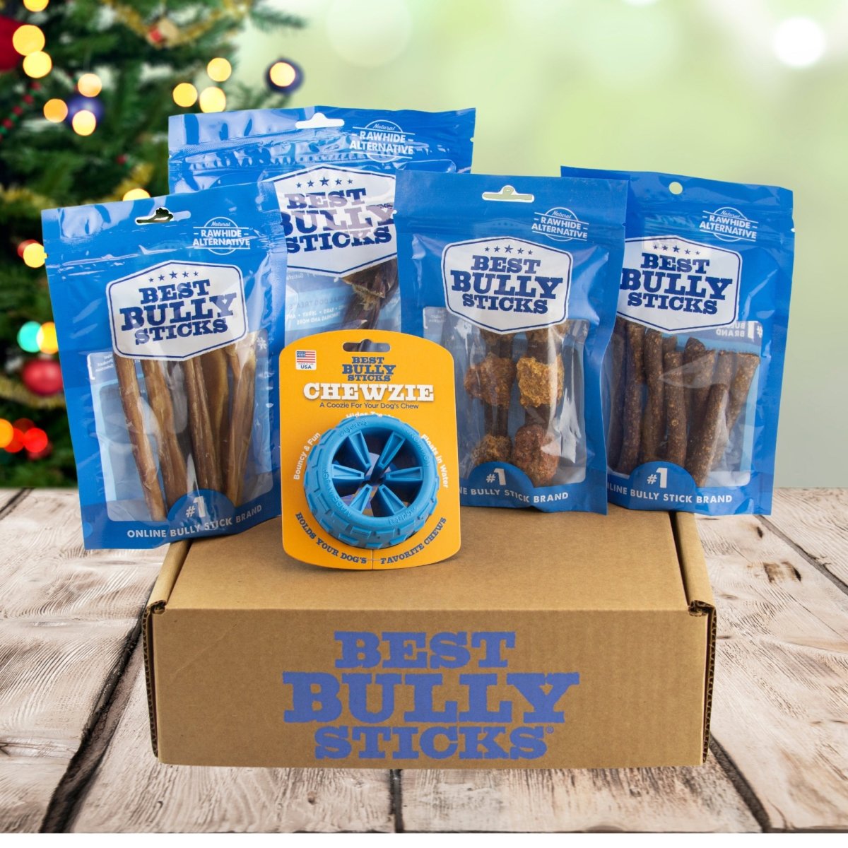 Christmas gift box featuring The BEST Holiday Treats &amp; Chews Box by Best Bully Sticks for your puppy&#39;s enjoyment.
